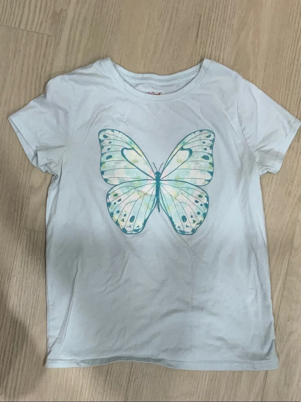 Athletic set. Kids Navy Blue Casual Shorts with light blue butterfly shirt.